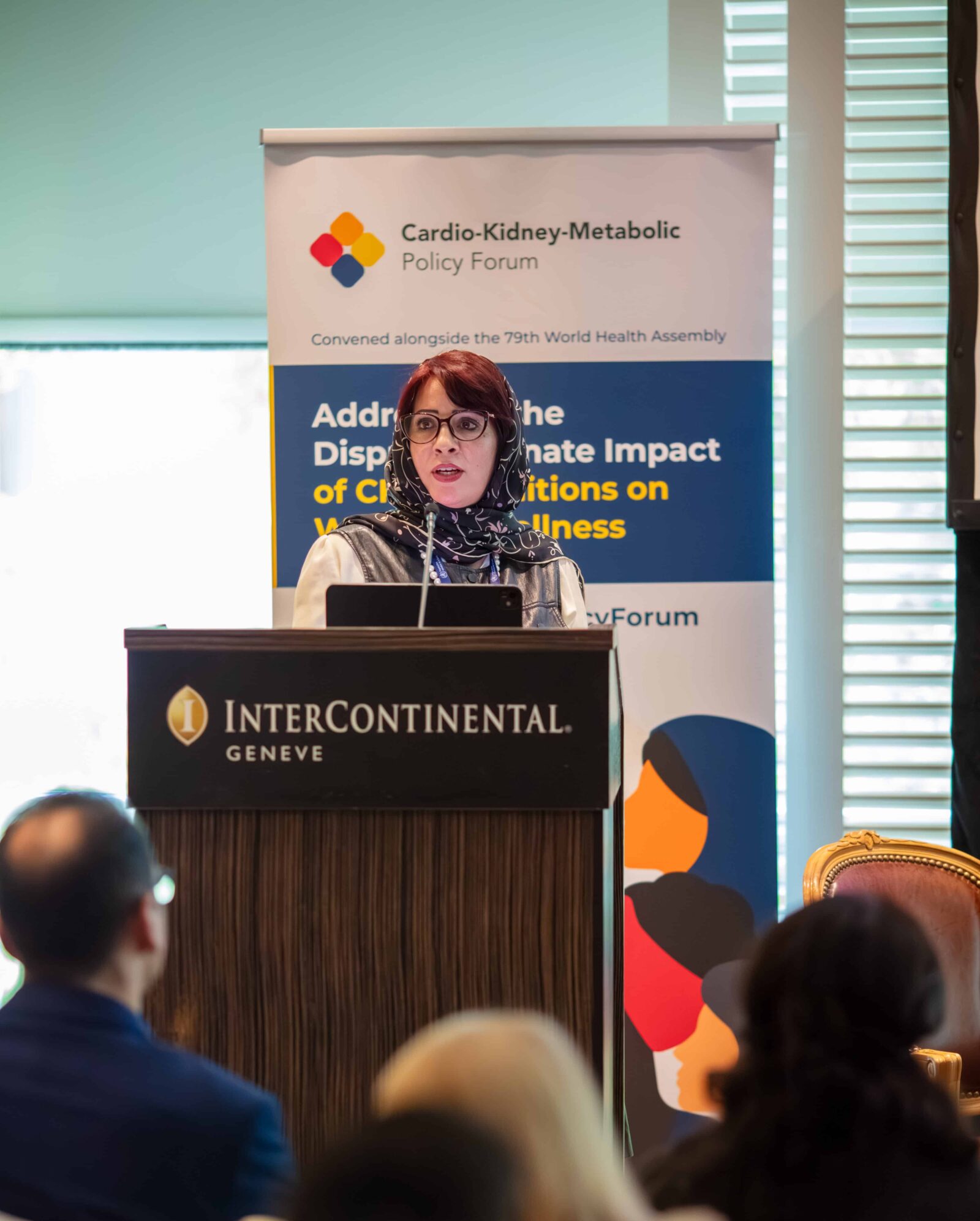 Woman speaking at a podium during the Cardio-Kidney-Metabolic Policy Forum